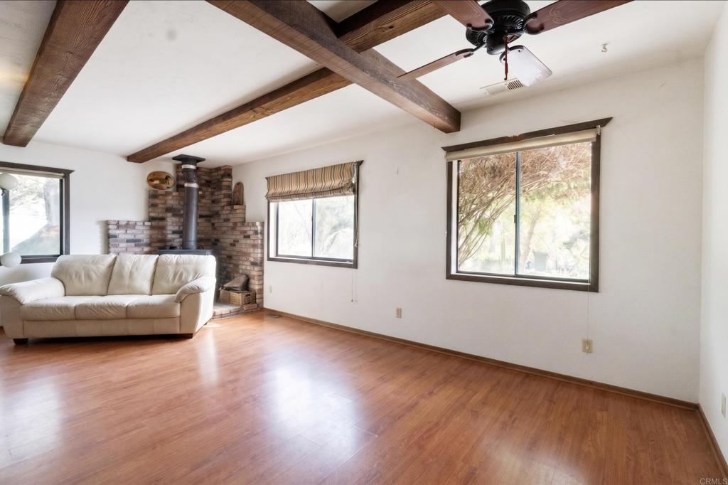 823 Rice Canyon Road Fallbrook, CA 92028 - Photo 9 of 30 a living room with furniture and a wooden floor