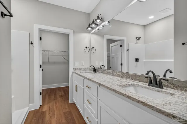 a view of a room with wooden floor