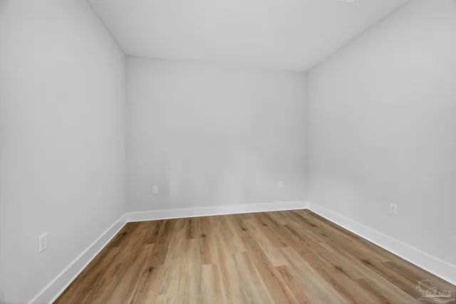 a bathroom with a granite countertop toilet a sink and a granite counter tops