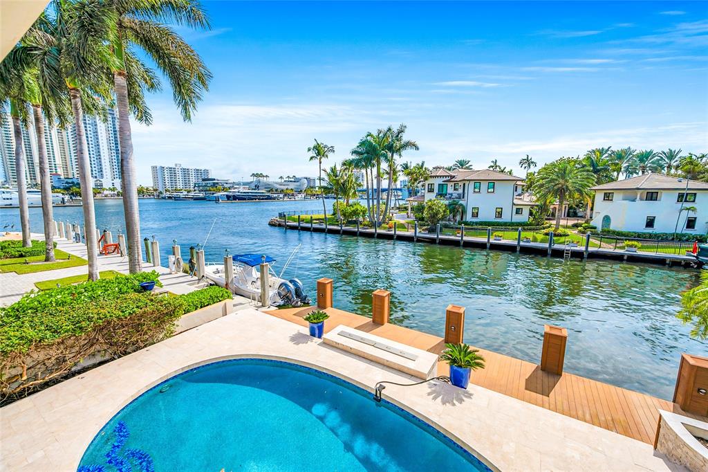 2626 Castilla Isle Fort Lauderdale, FL 33301 - Photo 1 of 18 a view of a lake with a building and outdoor space