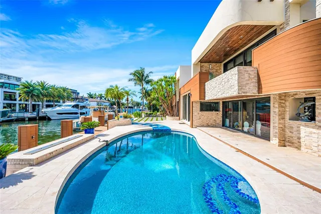 a view of a swimming pool with a lounge chairs
