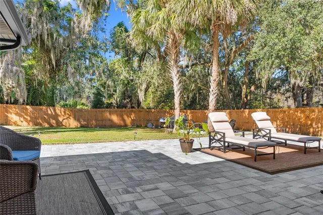 a view of a patio with swimming pool