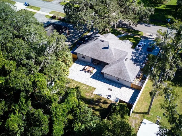 an aerial view of residential houses with outdoor space