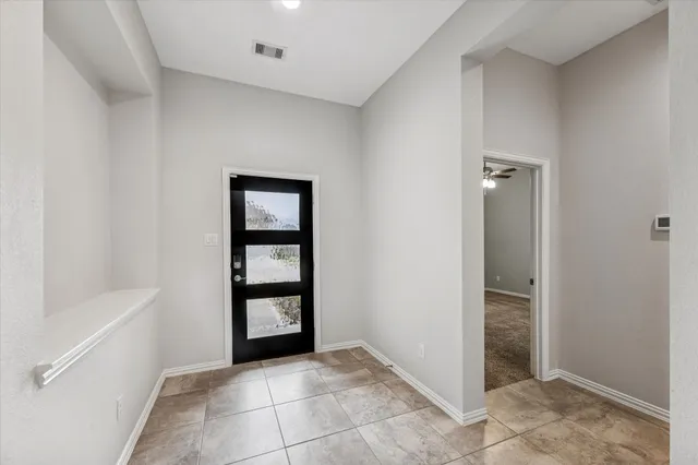 a view of an empty room and window