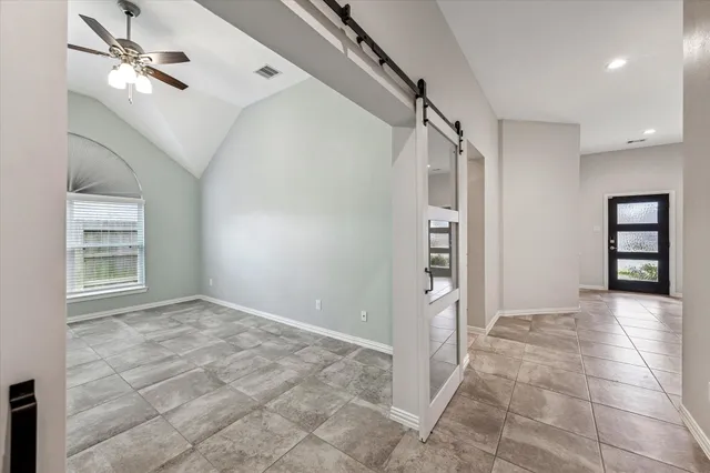 a view of an empty room with a window