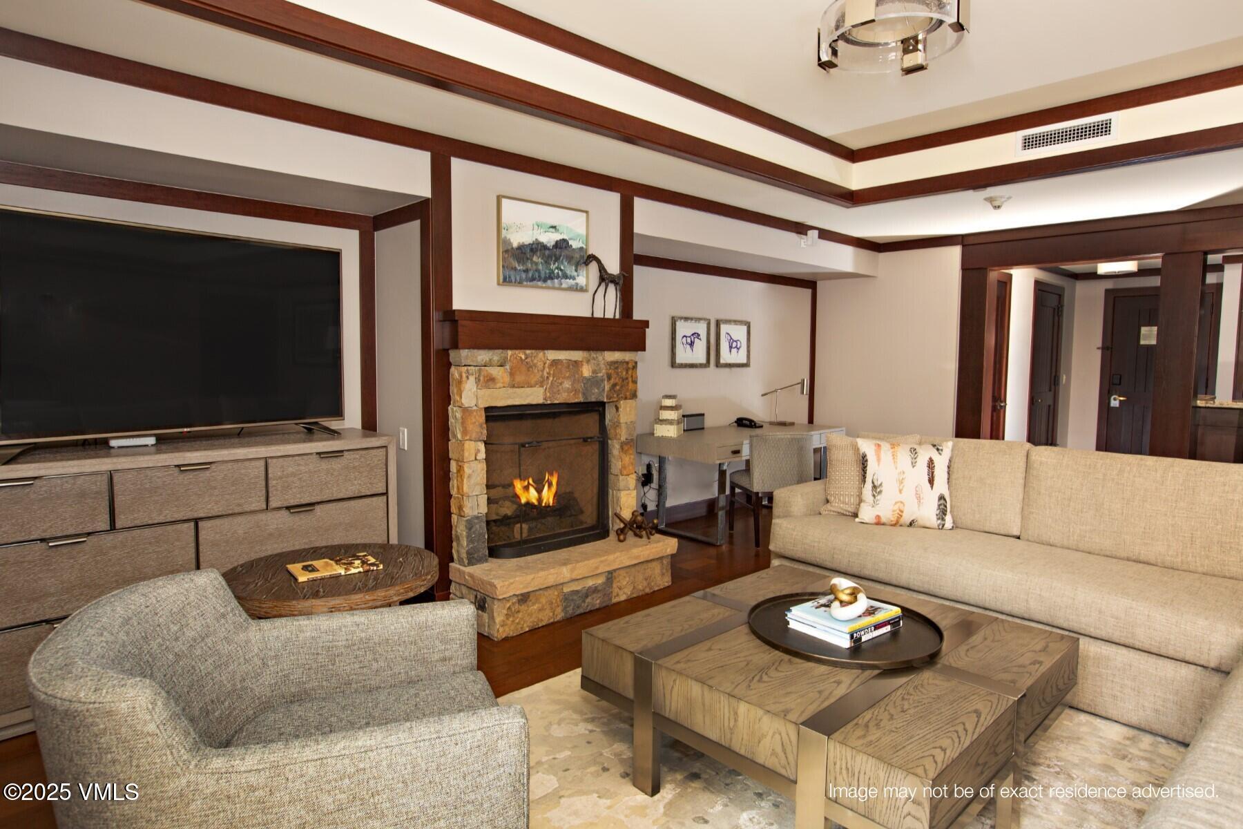 1 Vail Road, Unit 5101J Vail, CO 81657 - Photo 4 of 10 Living area and Fireplace