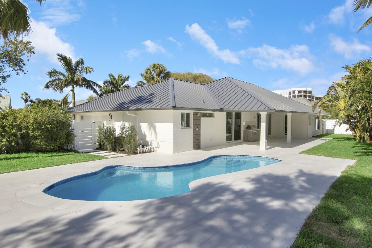 1504 Ocean Way Jupiter, FL 33477 - Photo 1 of 17 a view of house with outdoor space and swimming pool