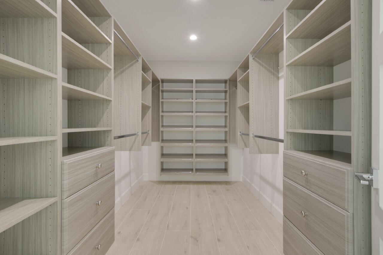 1504 Ocean Way Jupiter, FL 33477 - Photo 14 of 17 a view of walk in closet with empty racks