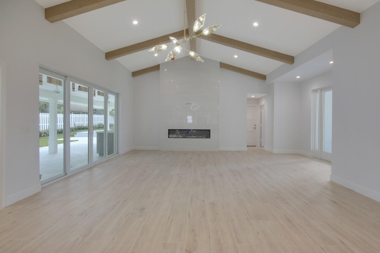 1504 Ocean Way Jupiter, FL 33477 - Photo 6 of 17 a view of an empty room with a chandelier