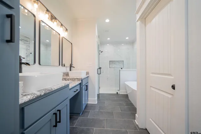 a bathroom with a bathtub and a sink