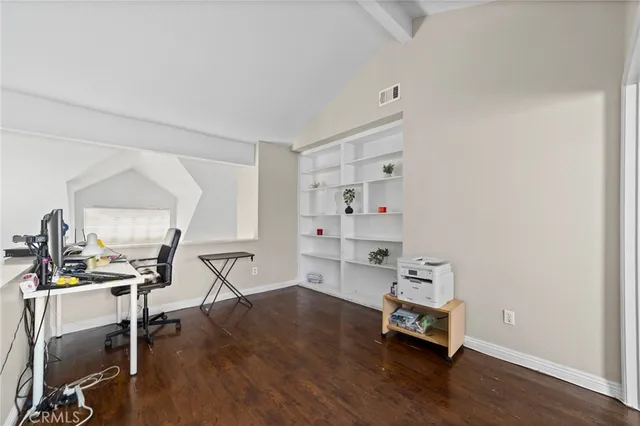 a room with a wooden floor and a chair