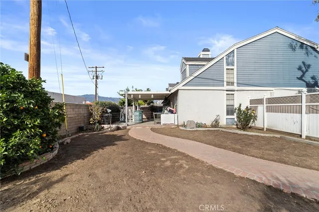 a view of a house next to a road
