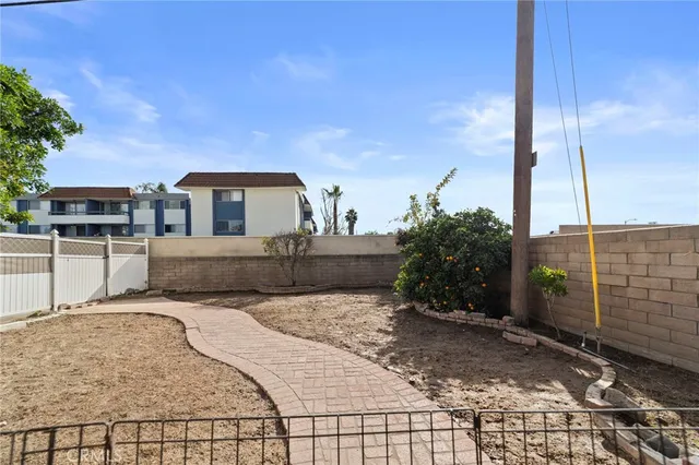 a view of a backyard with sitting area