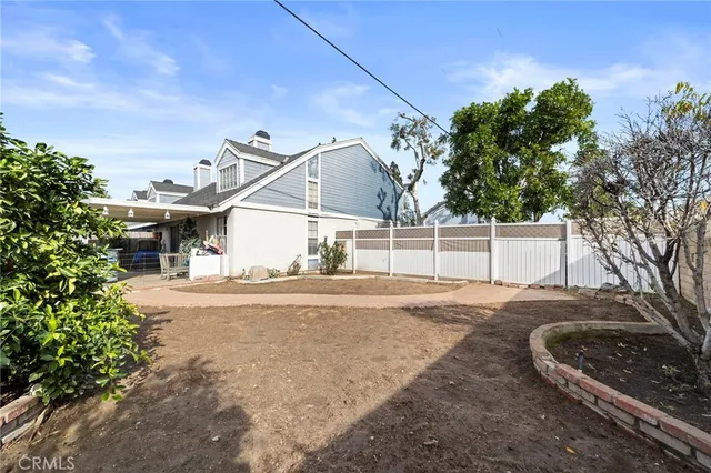 a view of a house with a yard and garage