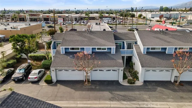 an aerial view of a house with garden garage and outdoor seating