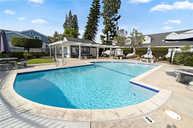 a view of a swimming pool with a patio