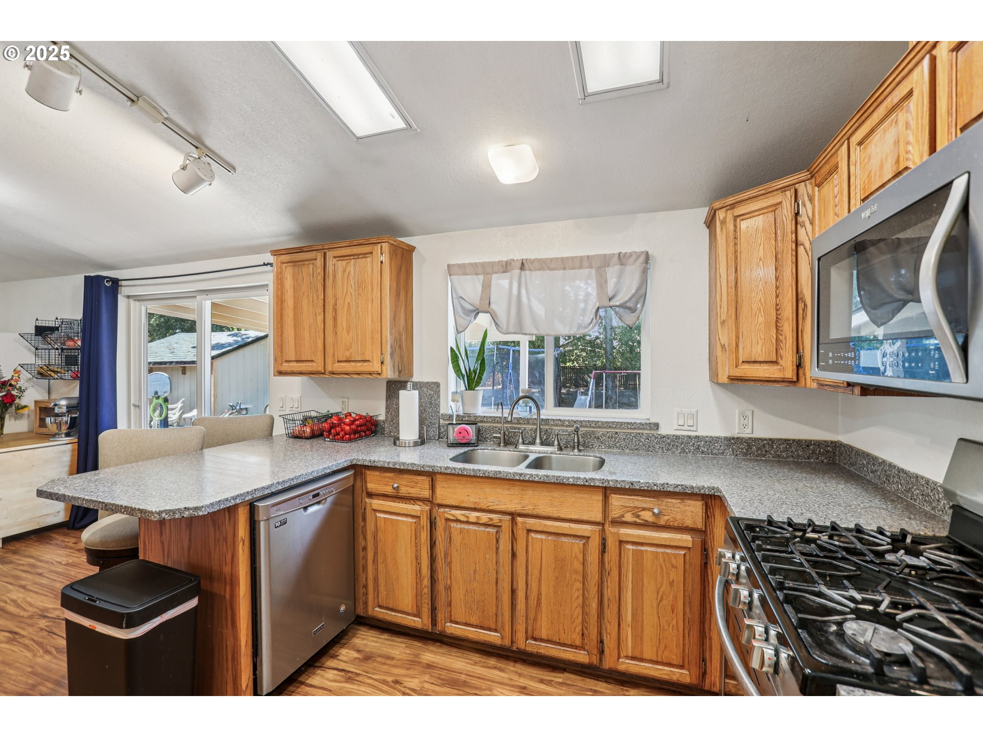 914 James Street Independence, OR 97351 - Photo 16 of 48 a kitchen with sink stove and cabinets