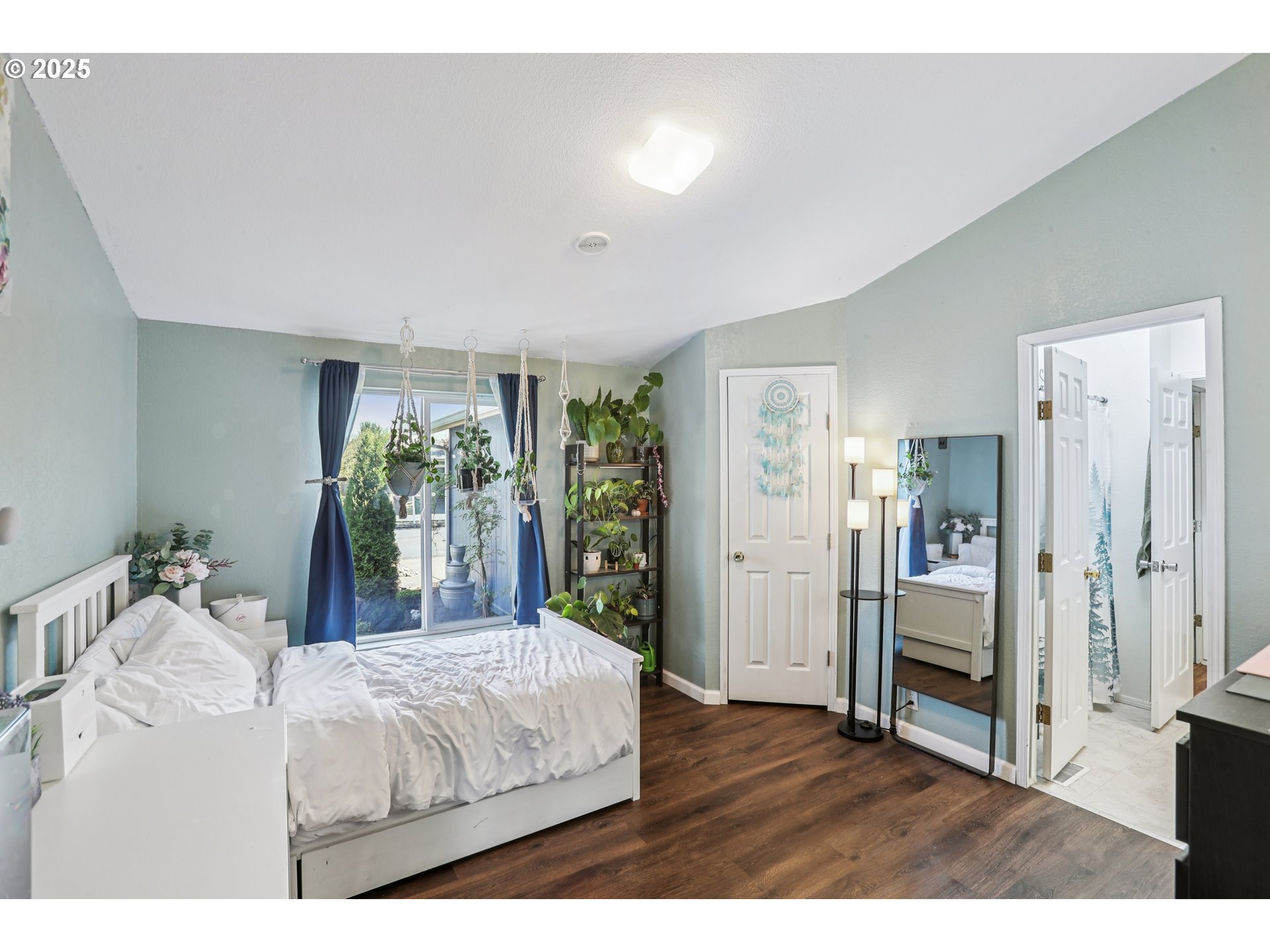 914 James Street Independence, OR 97351 - Photo 23 of 48 a bedroom with a large bed and wooden floor