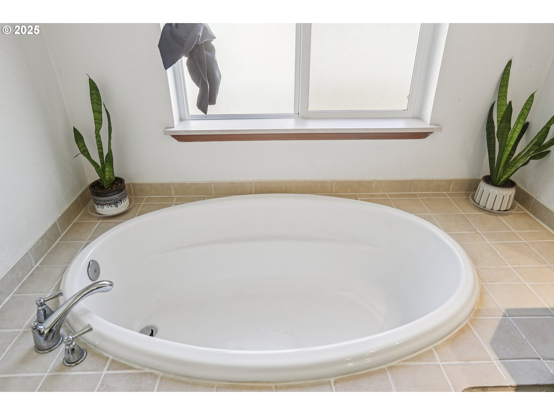 914 James Street Independence, OR 97351 - Photo 30 of 48 a white bath tub sitting in a bathroom