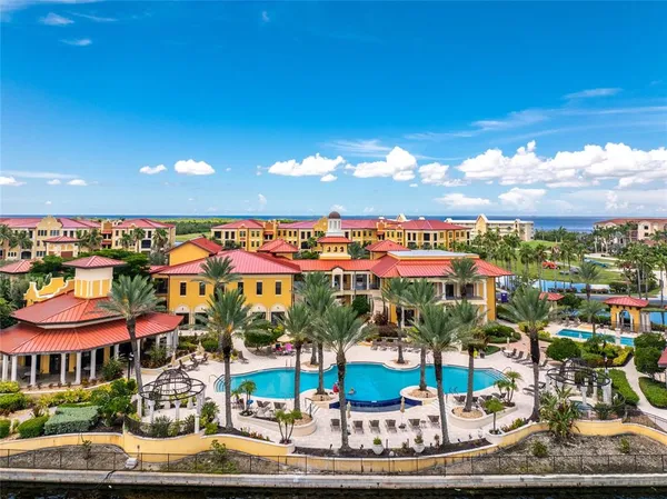 a swimming pool with outdoor seating