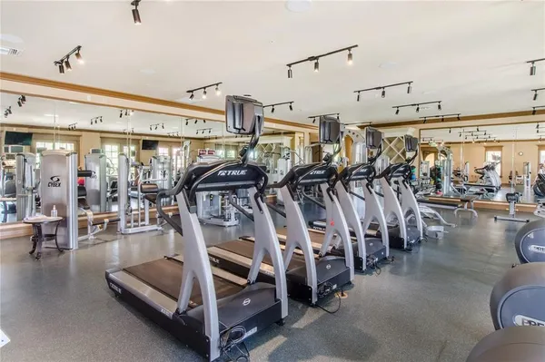 a view of a lake with houses in the background