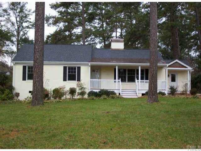 2205 Coley Forest Place Raleigh, NC 27607 - Photo 1 of 1 a front view of a house with a garden