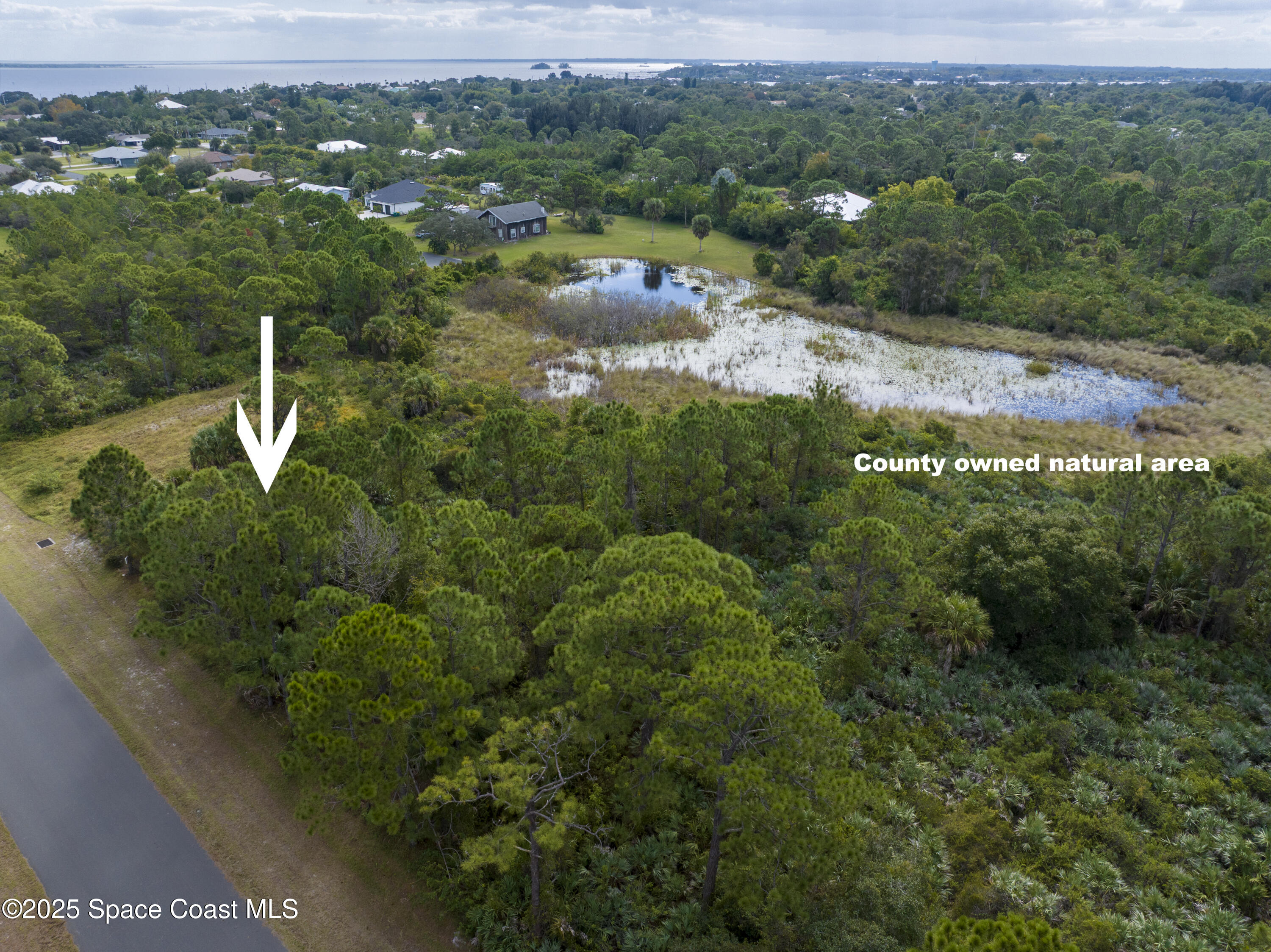 0 11th Street Sebastian, FL 32976 - Photo 7 of 8 an aerial view of residential house with outdoor space and trees all around