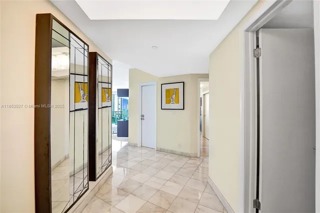 a kitchen with stainless steel appliances granite countertop a stove a microwave and a refrigerator