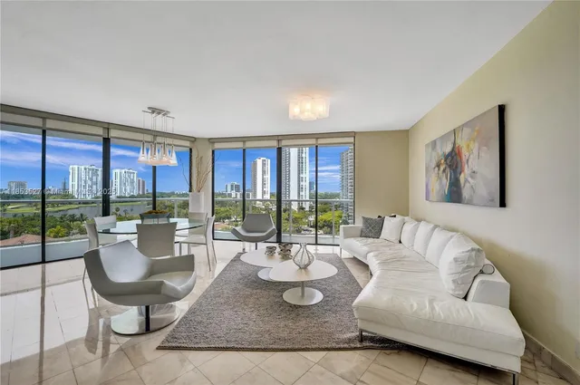 a bedroom with two beds and a large window