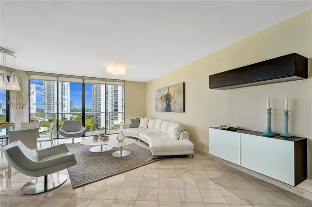a bedroom with a bed and glass wall mirror