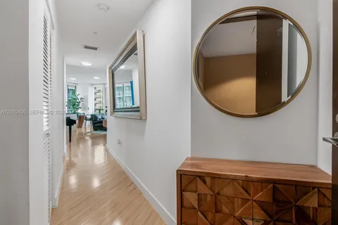 a view of a hallway view with wooden floor and staircase