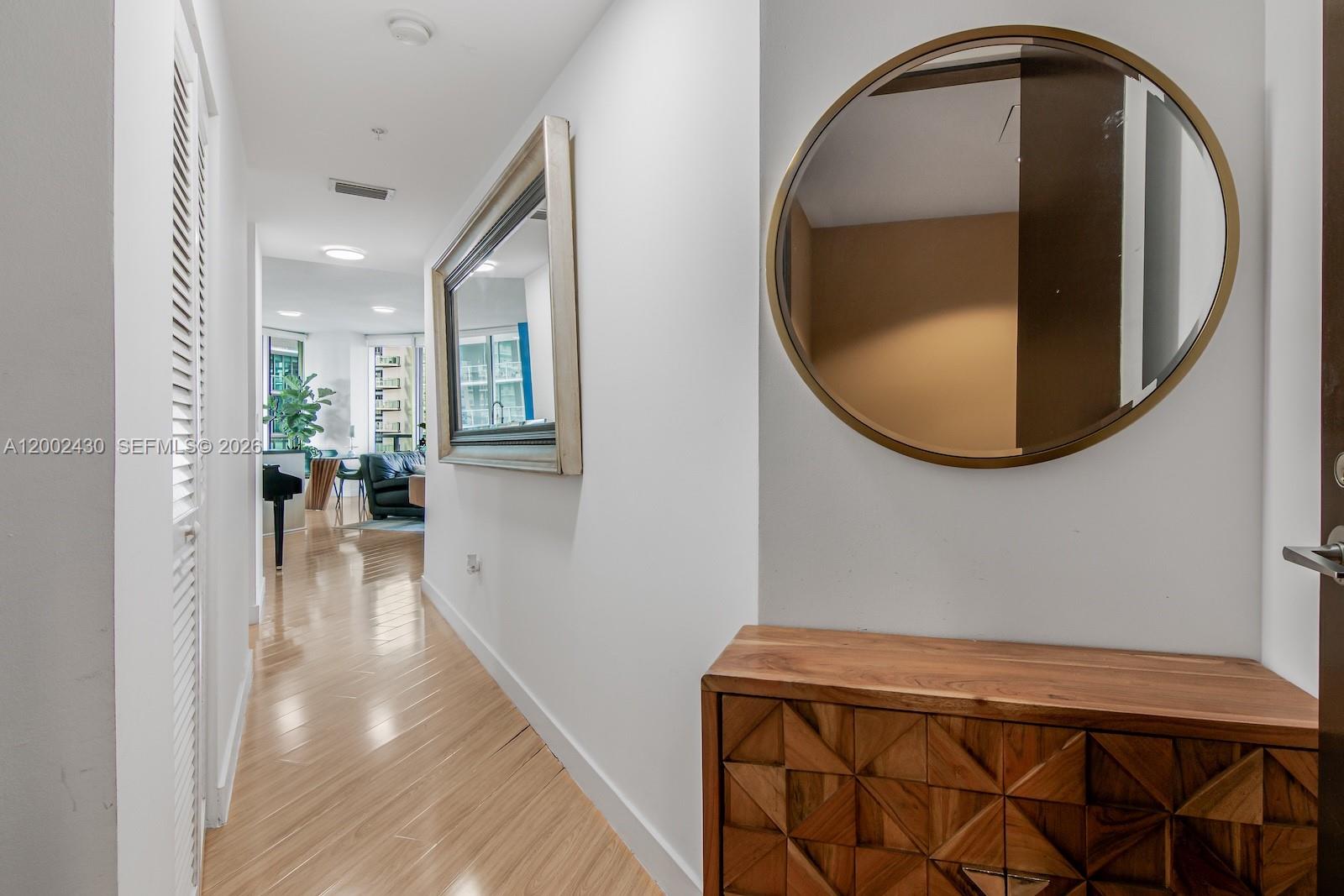 79 Southwest 12th Street, Unit 2107S Miami, FL 33130 - Photo 4 of 47 a view of a livingroom with furniture and wooden floor
