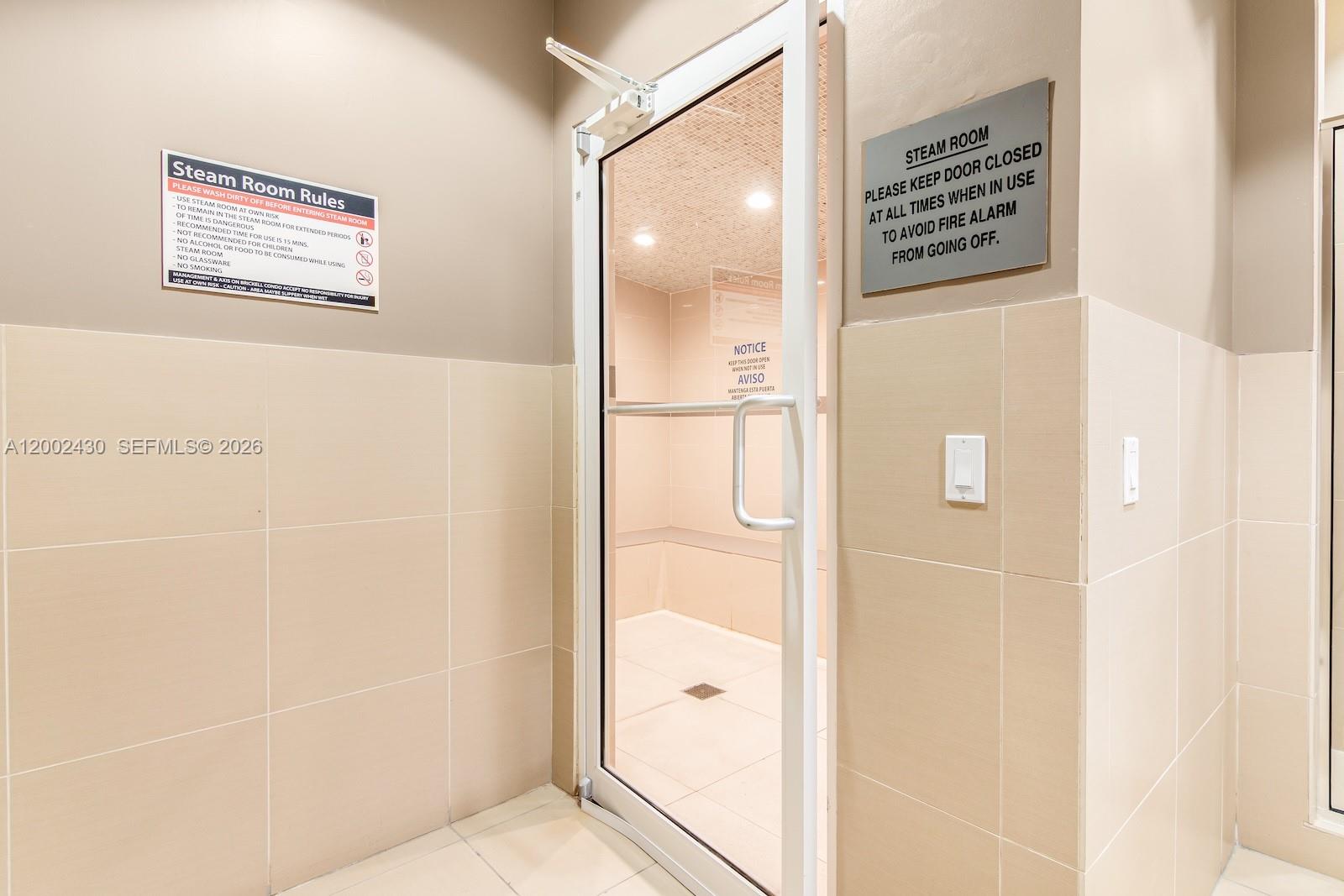 79 Southwest 12th Street, Unit 2107S Miami, FL 33130 - Photo 45 of 47 a bathroom with a shower