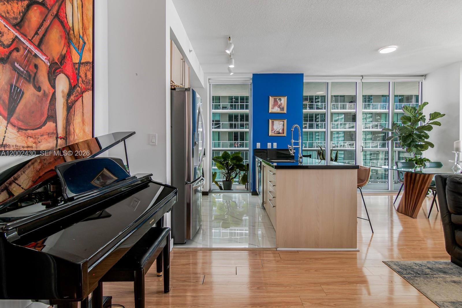 79 Southwest 12th Street, Unit 2107S Miami, FL 33130 - Photo 9 of 47 a living room with furniture and a fireplace
