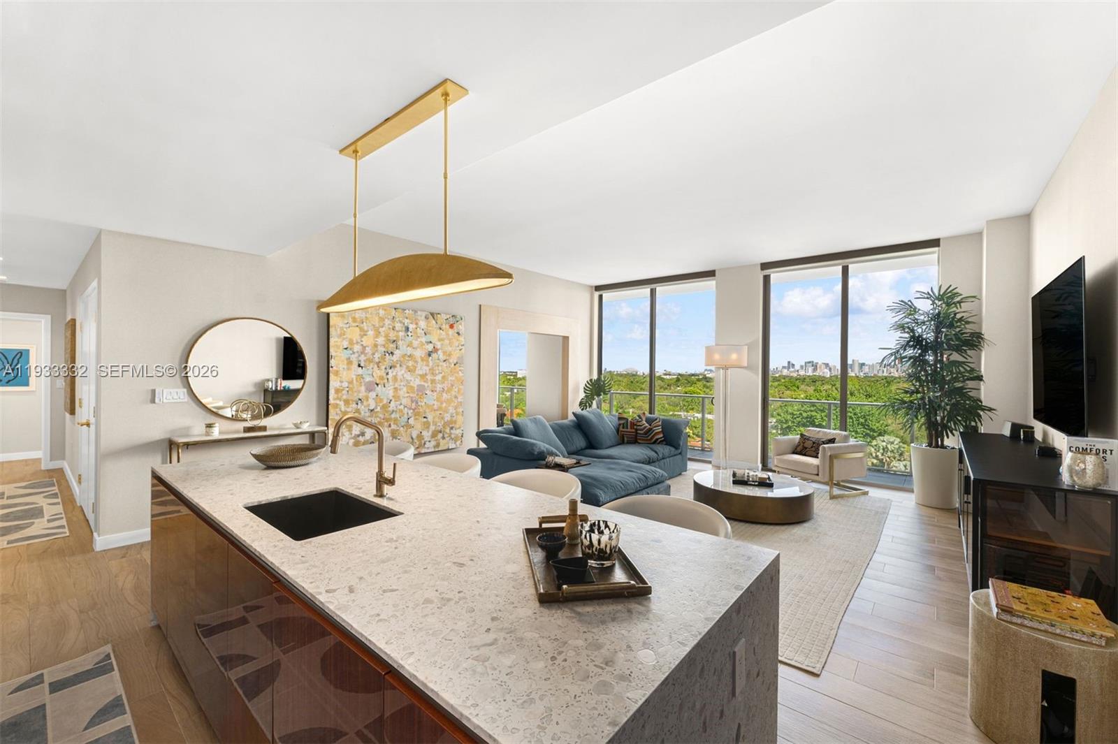 a kitchen with a table chairs stove and flat screen tv