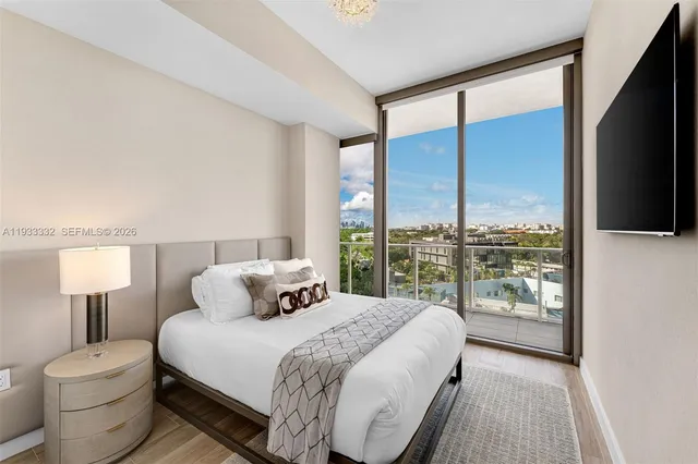 a bathroom with a shower a mirror and a sink