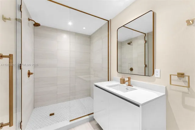 a bedroom with a large bed and a large window