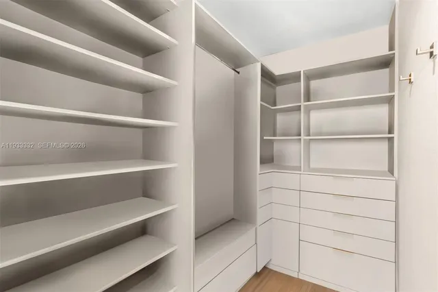 a bathroom with a tub and a view of bathroom