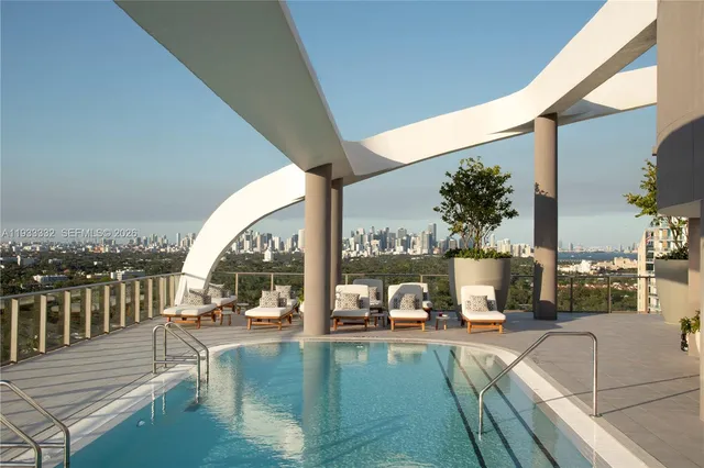 a view of a swimming pool with a patio