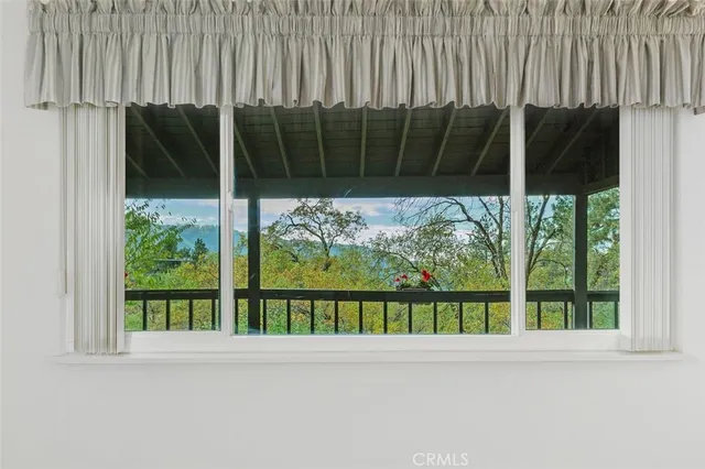 a view of kitchen with granite countertop cabinets and a sink