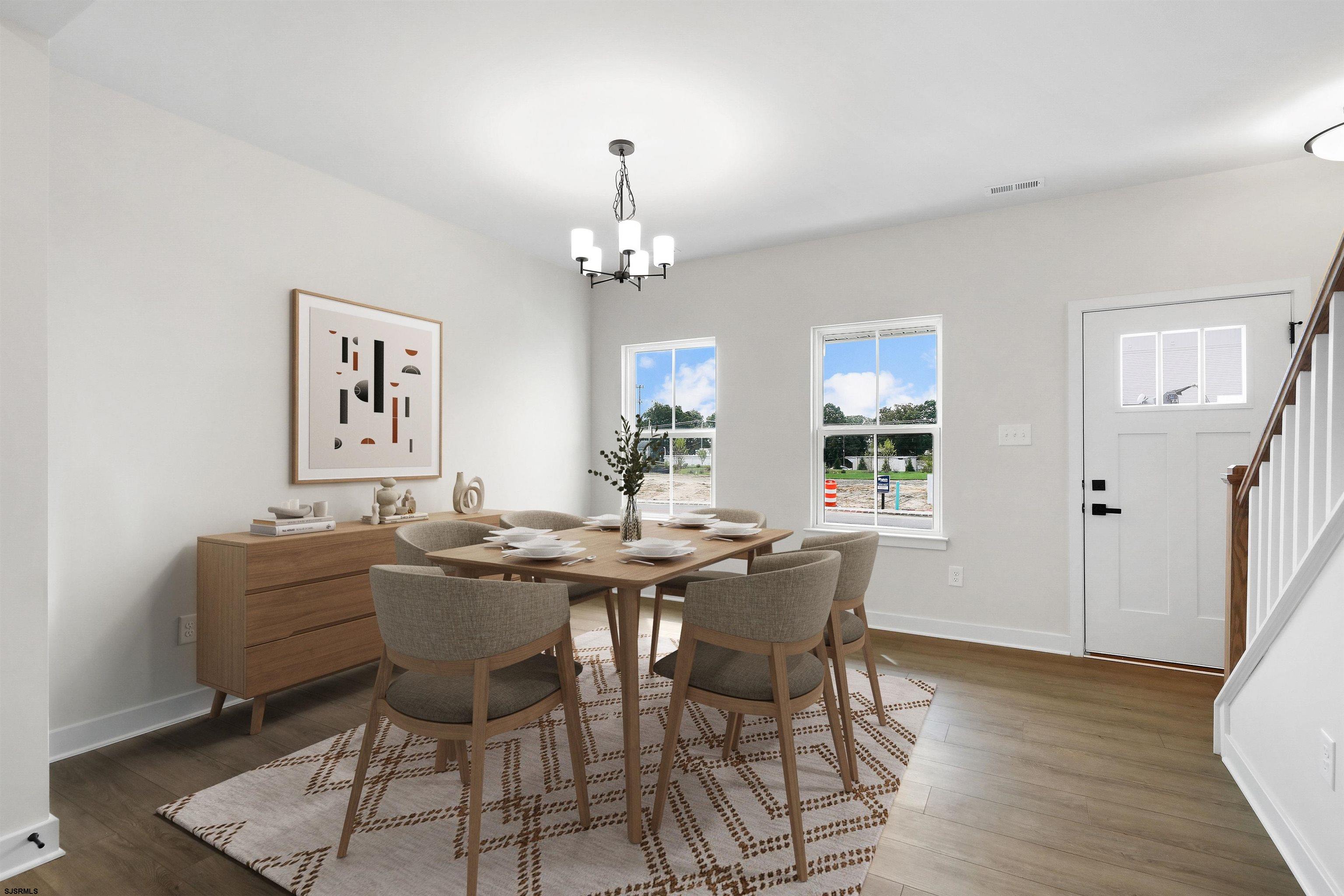 705 Jesse Drive, Unit 705 Somers Point, NJ 08244 - Photo 2 of 15 a view of a dining room with furniture and wooden floor
