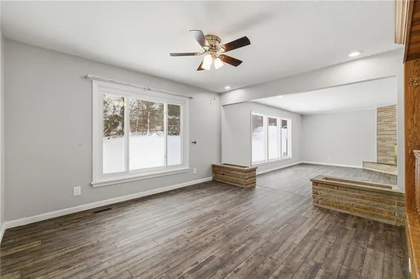 a view of livingroom with hardwood floor and ceiling fan
