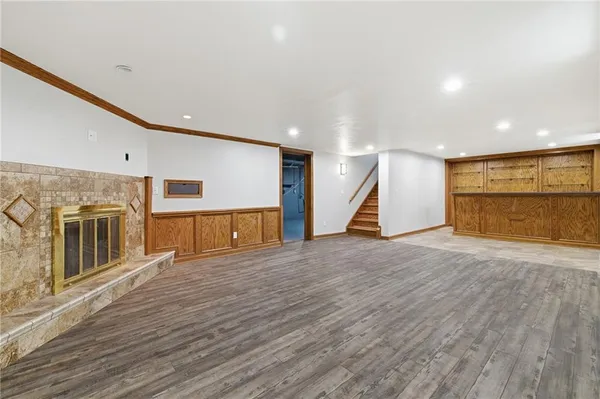 a view of a kitchen with a sink and a large window