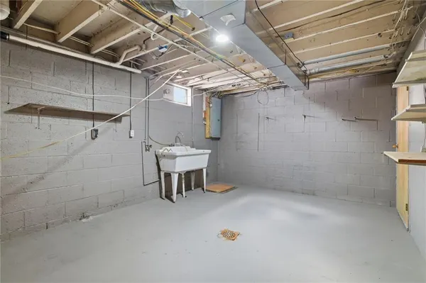 a view of a room with table and chairs