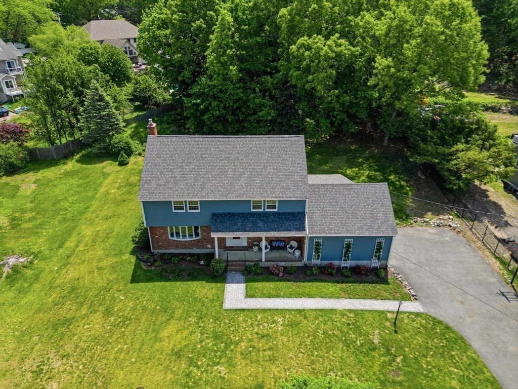 94 Johnson Road Winchester, MA 01890 - Photo 37 of 40 an aerial view of a house with swimming pool and a yard