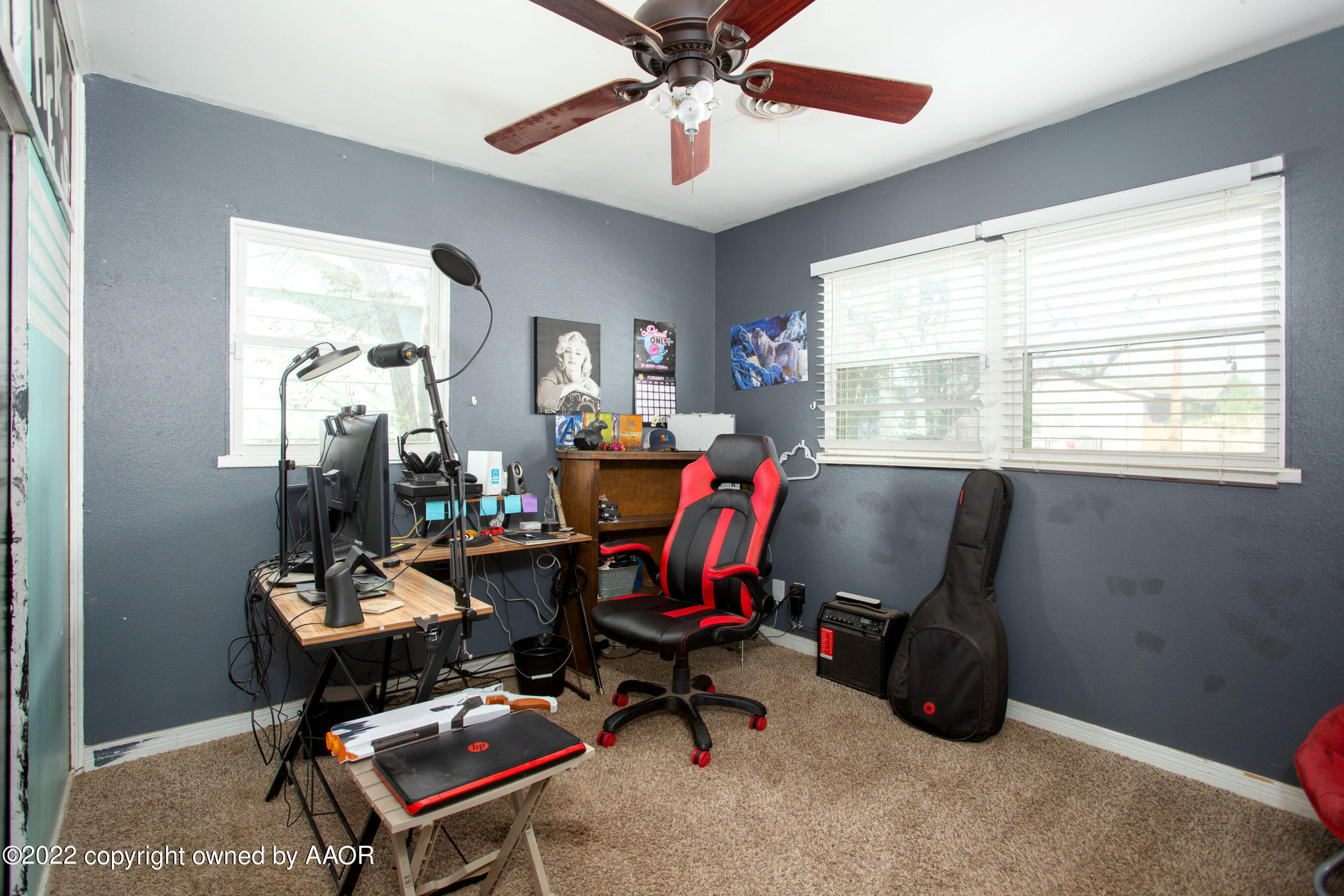 5310 Tumbleweed Drive Amarillo, TX 79110 - Photo 17 of 23 a view of a workspace with furniture and a window