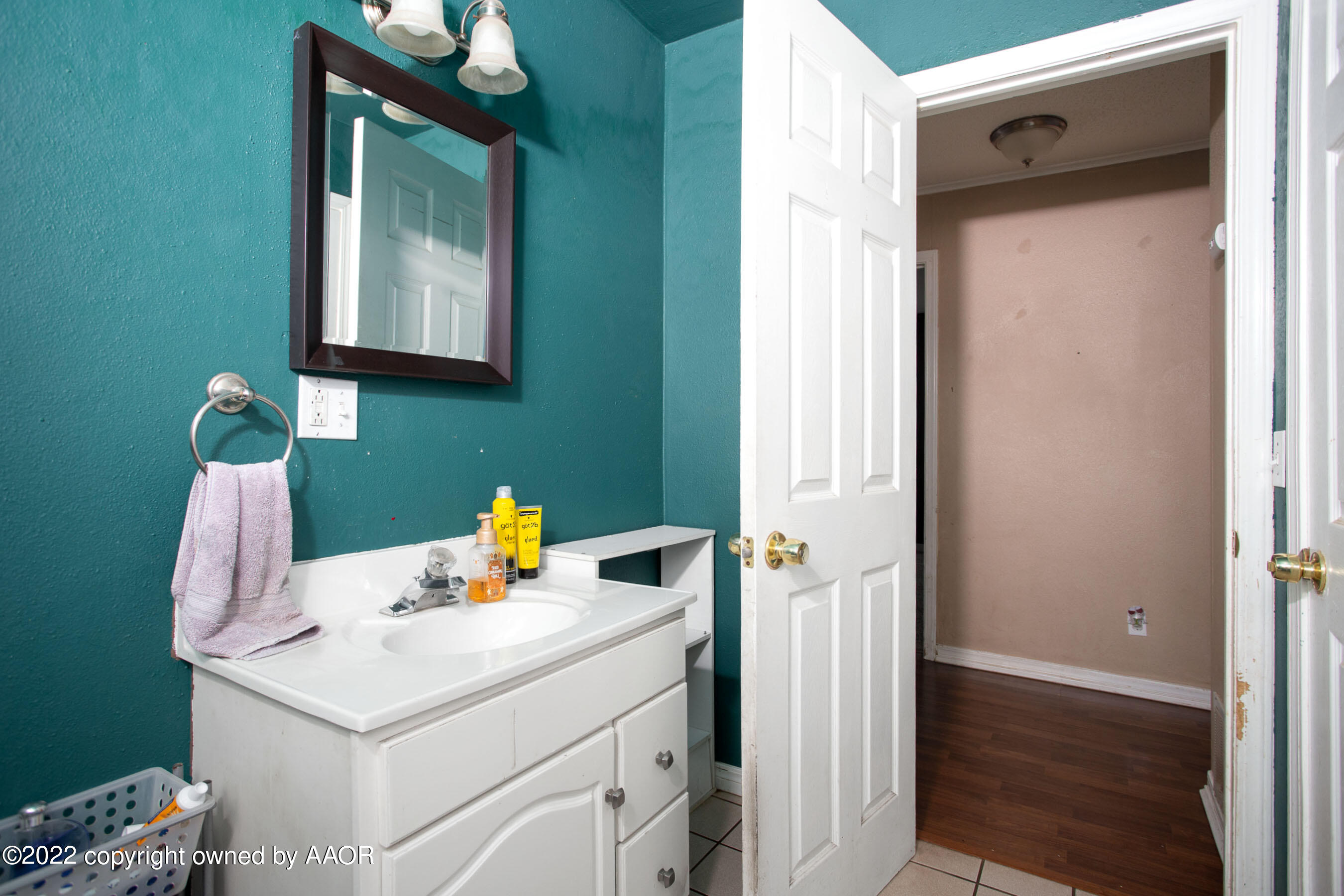 5310 Tumbleweed Drive Amarillo, TX 79110 - Photo 19 of 23 a bathroom with a sink and a mirror