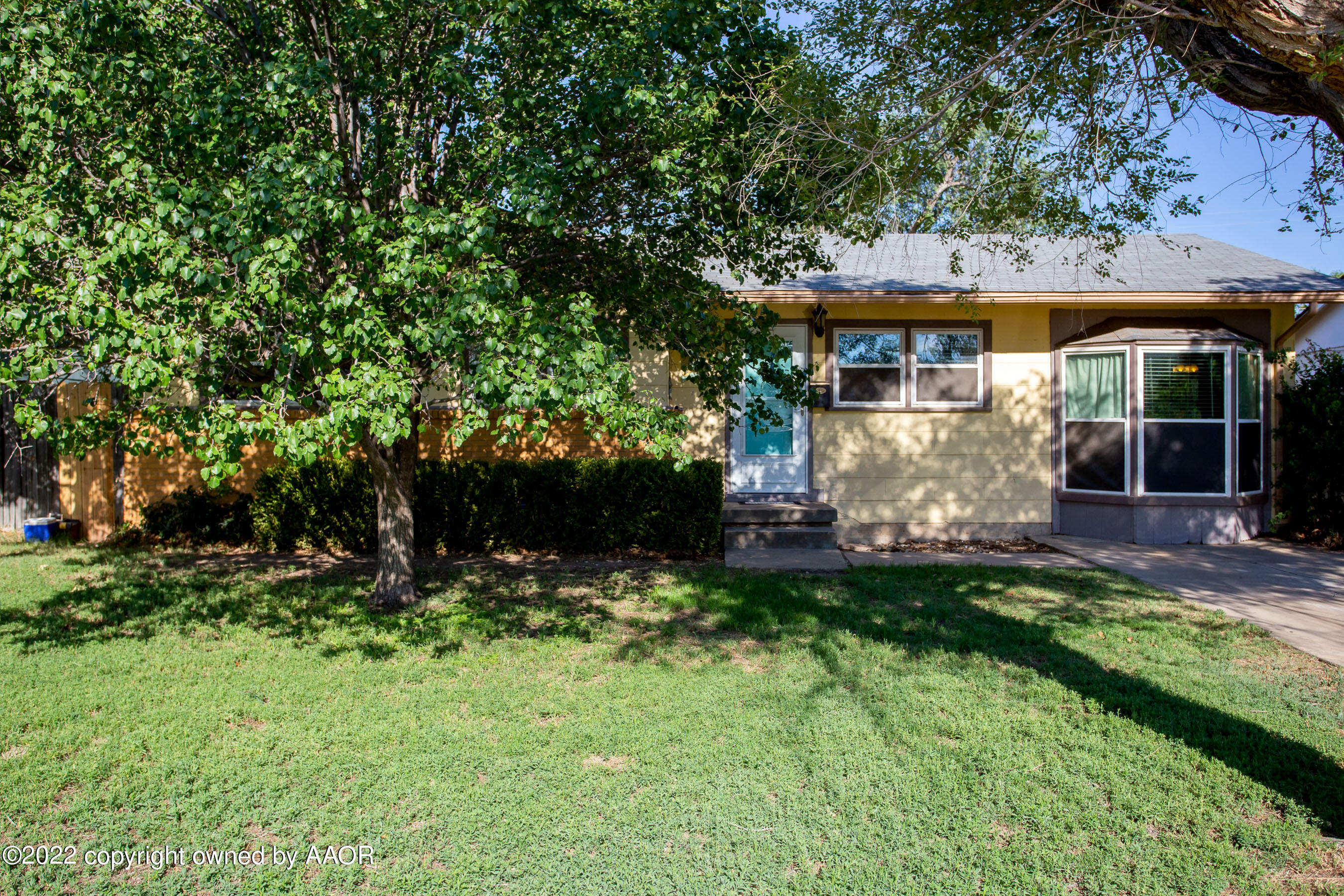 5310 Tumbleweed Drive Amarillo, TX 79110 - Photo 2 of 23 a front view of a house with a garden