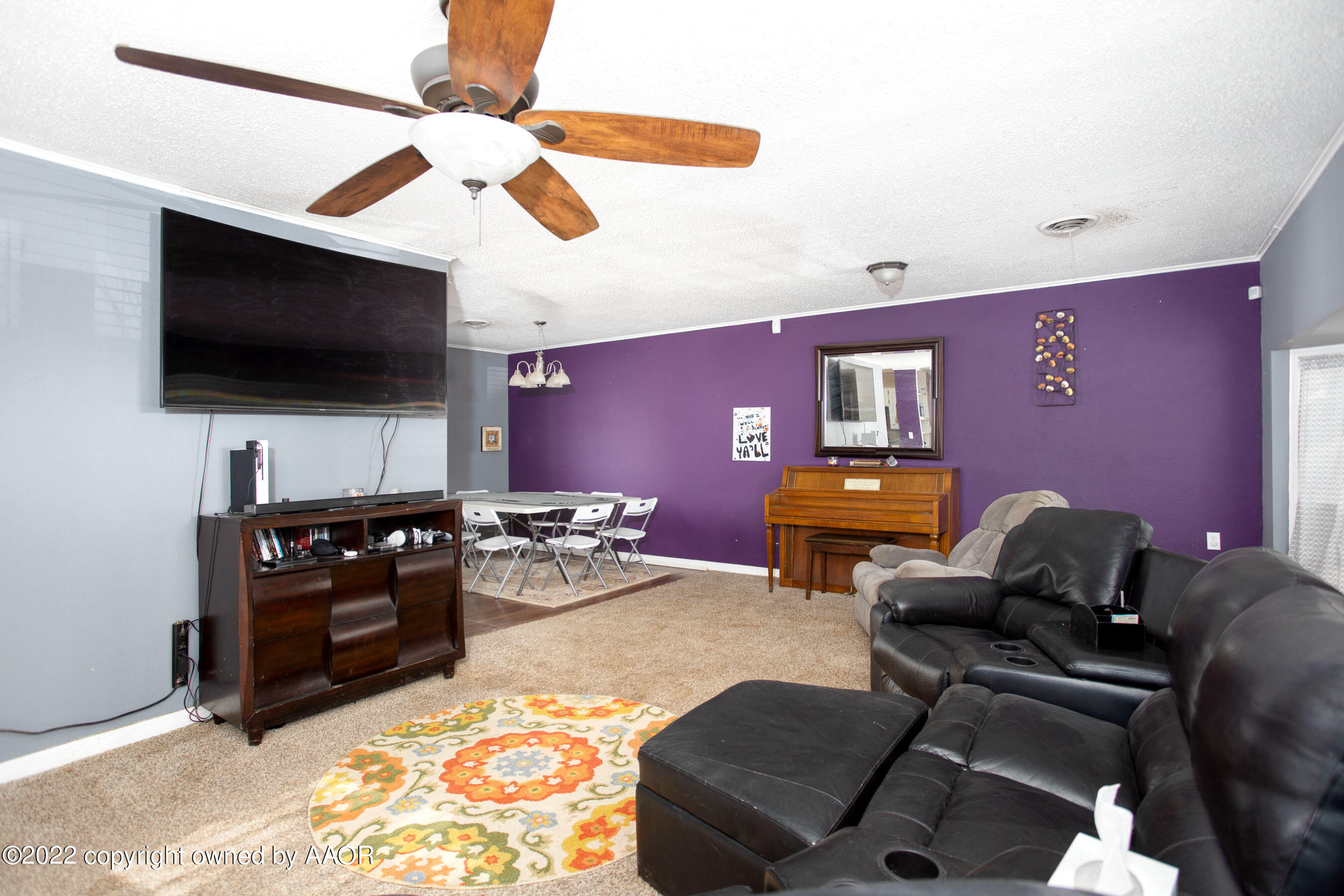 5310 Tumbleweed Drive Amarillo, TX 79110 - Photo 5 of 23 a living room with furniture and a flat screen tv
