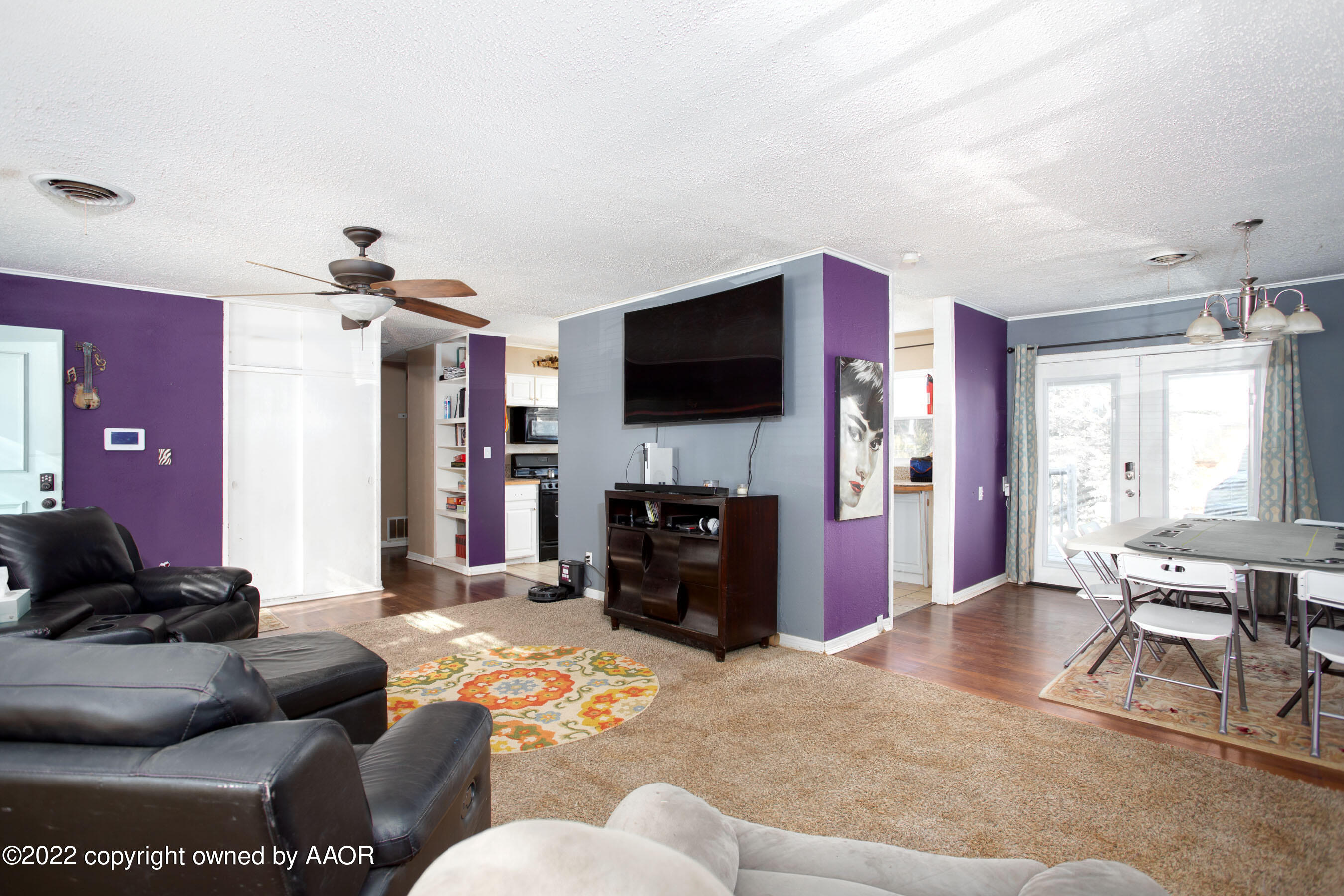 5310 Tumbleweed Drive Amarillo, TX 79110 - Photo 6 of 23 a living room with furniture and a flat screen tv